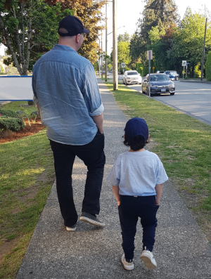 Author and his son walking together
